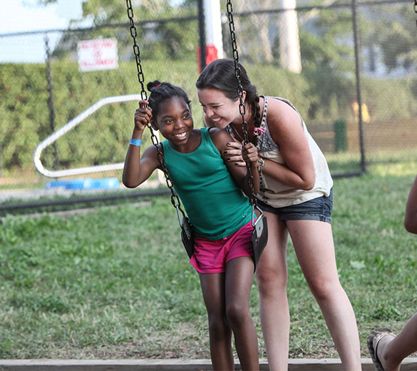 two girls on swing