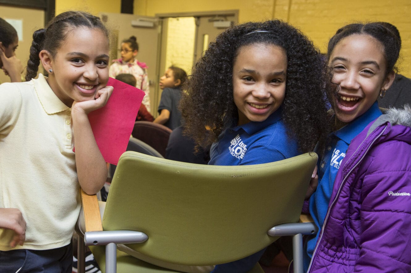 three girls smiling