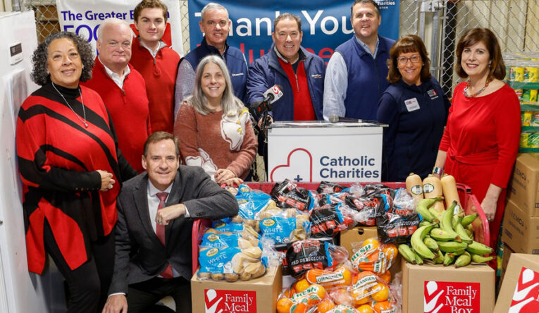 Staff and city officials at a food pantry press conference
